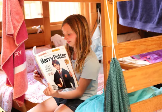 Kanata camper reading in cabin